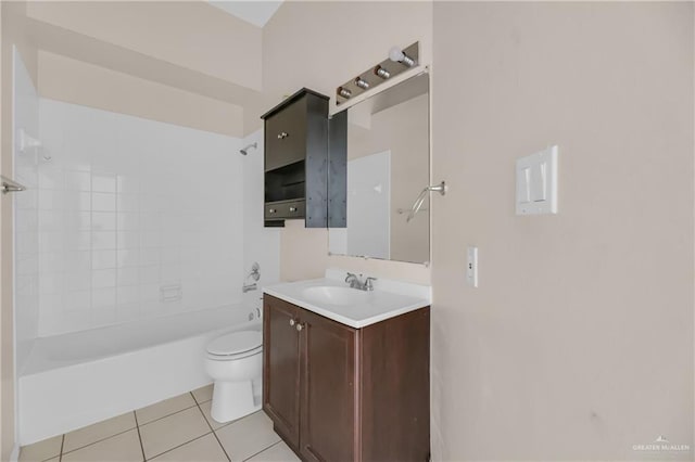 full bathroom featuring tiled shower / bath, tile patterned floors, toilet, and vanity