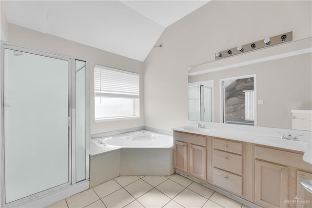 bathroom featuring vaulted ceiling, separate shower and tub, vanity, and tile patterned floors