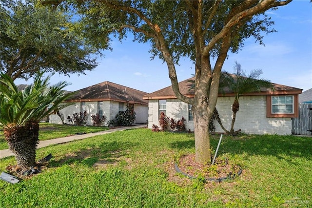 ranch-style house with a front yard