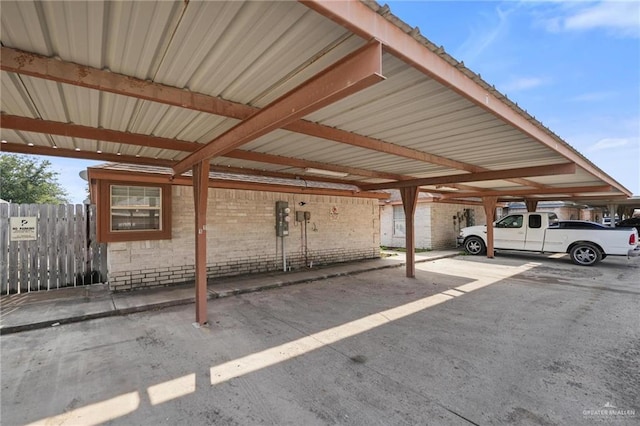 view of parking / parking lot with a carport