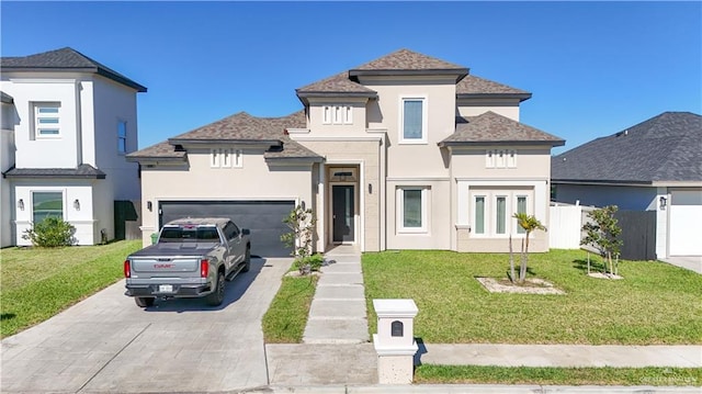 view of front of house with a front yard and a garage