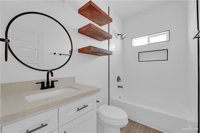 full bathroom with wood-type flooring, vanity, toilet, and tub / shower combination