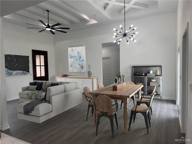 dining area featuring beam ceiling, dark hardwood / wood-style flooring, and a high ceiling