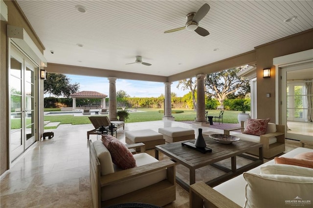 view of patio featuring an outdoor hangout area and ceiling fan