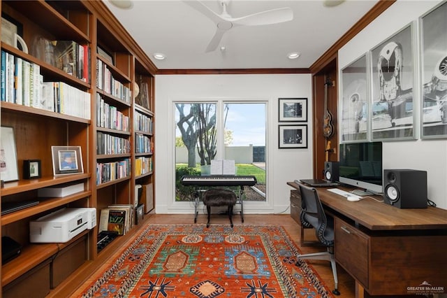 office area featuring light hardwood / wood-style flooring, ceiling fan, and crown molding