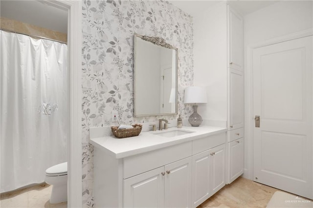 bathroom with vanity and toilet