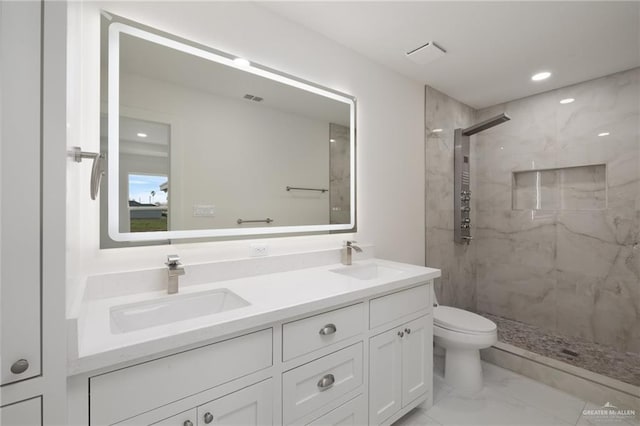 bathroom featuring a sink, double vanity, a marble finish shower, toilet, and marble finish floor