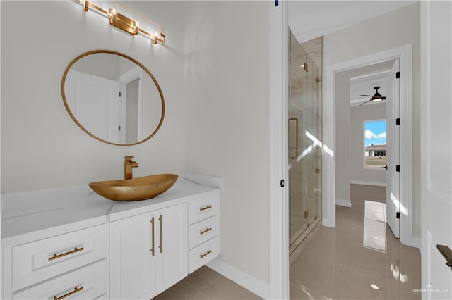 bathroom with tile patterned flooring, vanity, and an enclosed shower