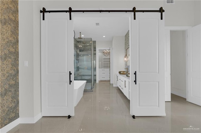 bathroom with vanity, tile patterned floors, and plus walk in shower