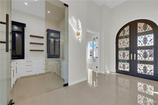 tiled entrance foyer with french doors