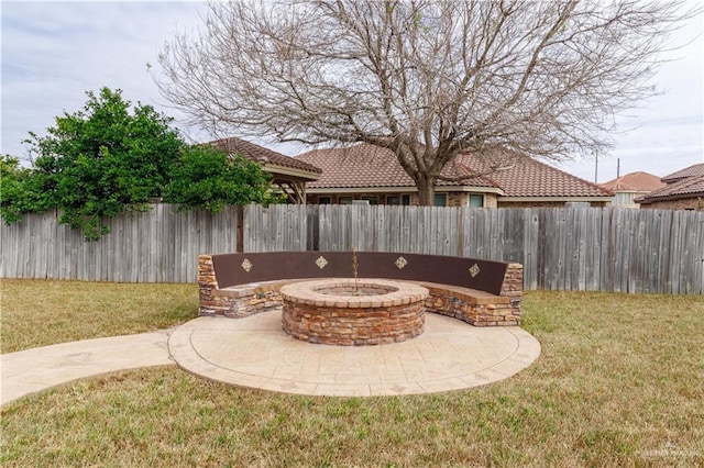 view of patio / terrace with an outdoor fire pit and a fenced backyard