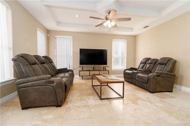 living room with coffered ceiling, visible vents, baseboards, and ceiling fan