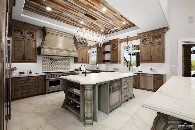 kitchen featuring open shelves, a tray ceiling, custom exhaust hood, and appliances with stainless steel finishes