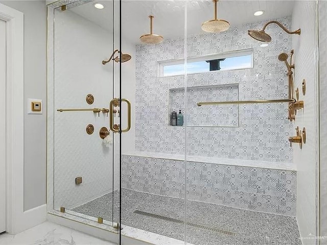 full bath featuring a stall shower, marble finish floor, and recessed lighting