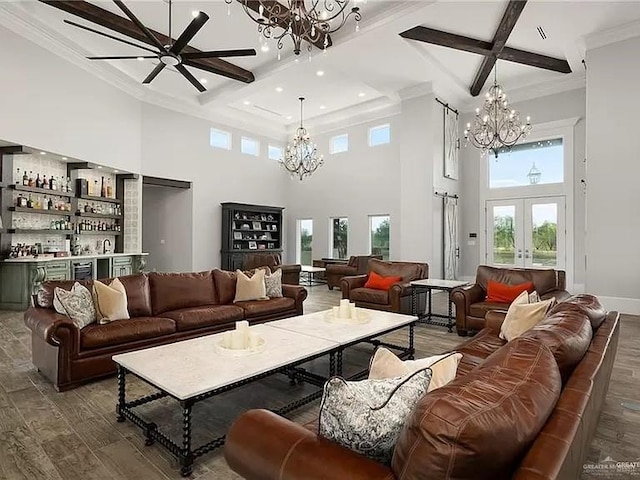 living area featuring a chandelier, french doors, and wood finished floors