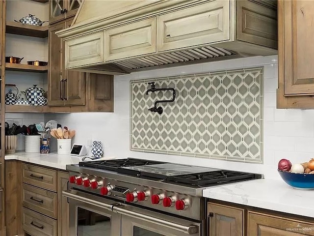 kitchen featuring open shelves, range with two ovens, and decorative backsplash