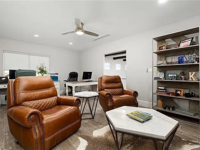 living area with recessed lighting, visible vents, ceiling fan, wood finished floors, and baseboards