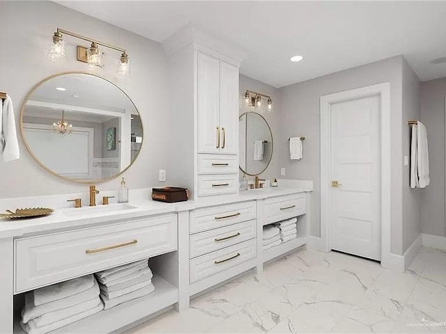 full bath with a chandelier, recessed lighting, vanity, baseboards, and marble finish floor