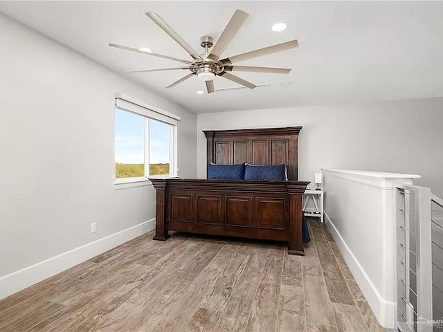 bedroom with baseboards, recessed lighting, a ceiling fan, and light wood-style floors