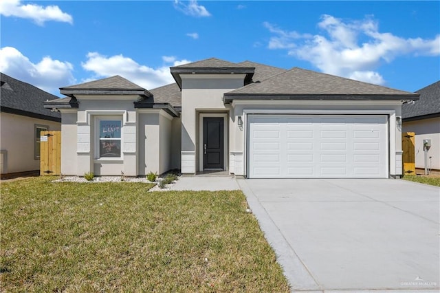 prairie-style home with a garage, concrete driveway, a front lawn, and stucco siding