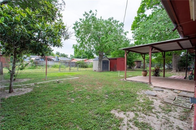 2401 E Austin Ave, Harlingen, TX 78550 - fenced backyard featuring a storage shed and a patio area