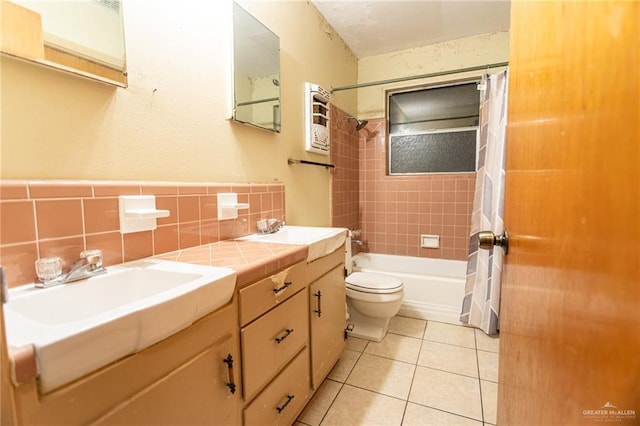2401 E Austin Ave, Harlingen, TX 78550 - bathroom with shower / bath combination with curtain, vanity, and tile patterned floors