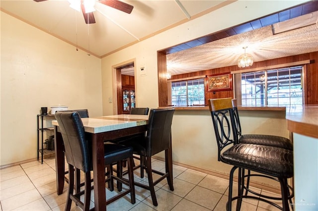 2401 E Austin Ave, Harlingen, TX 78550 - dining area featuring a ceiling fan, tile patterned flooring, and vaulted ceiling