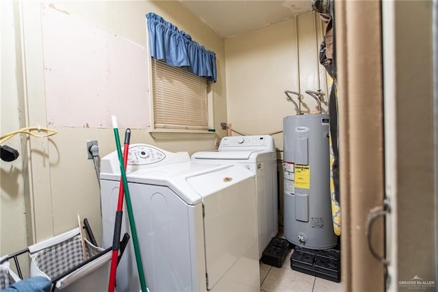 2401 E Austin Ave, Harlingen, TX 78550 - laundry room featuring electric water heater, washer and dryer, and tile patterned floors