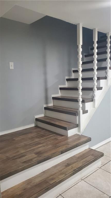 600 N Louisiana Ave N, Weslaco, TX 78596 - staircase featuring baseboards and wood finished floors