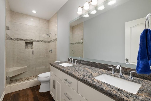 5313 N Crown Pt, Pharr, TX 78577 - full bath with a sink, toilet, a shower stall, and wood finished floors