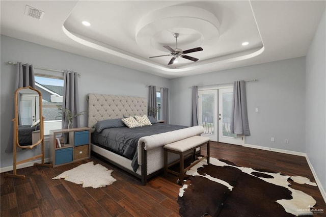 5313 N Crown Pt, Pharr, TX 78577 - bedroom featuring baseboards, a raised ceiling, dark wood finished floors, french doors, and access to exterior