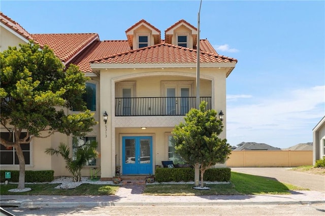 5313 N Crown Pt, Pharr, TX 78577 - mediterranean / spanish home with a balcony, french doors, stucco siding, and a tile roof