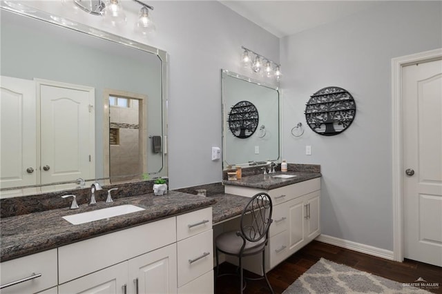 5313 N Crown Pt, Pharr, TX 78577 - bathroom with a shower stall, wood finished floors, vanity, and baseboards