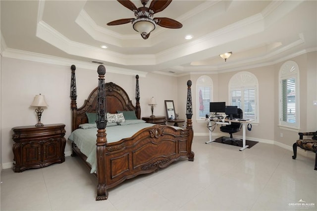 bedroom with ornamental molding, a tray ceiling, baseboards, and light tile patterned floors