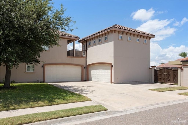 mediterranean / spanish house featuring stucco siding, concrete driveway, a gate, a balcony, and a garage