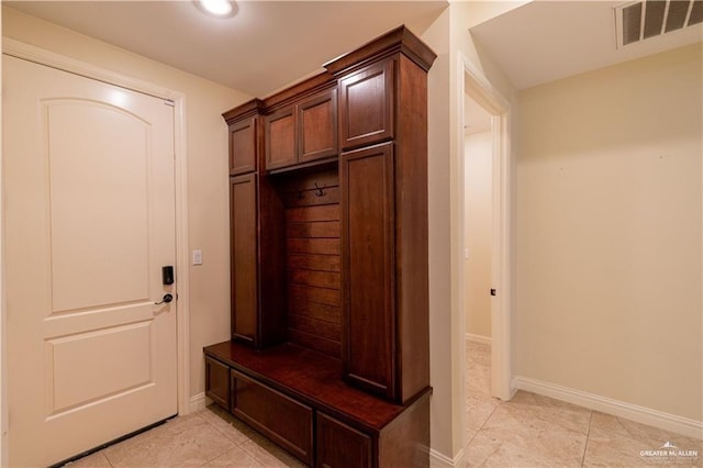 2014 Thacker Ln, Harlingen, TX 78552 - mudroom with light tile patterned floors and baseboards