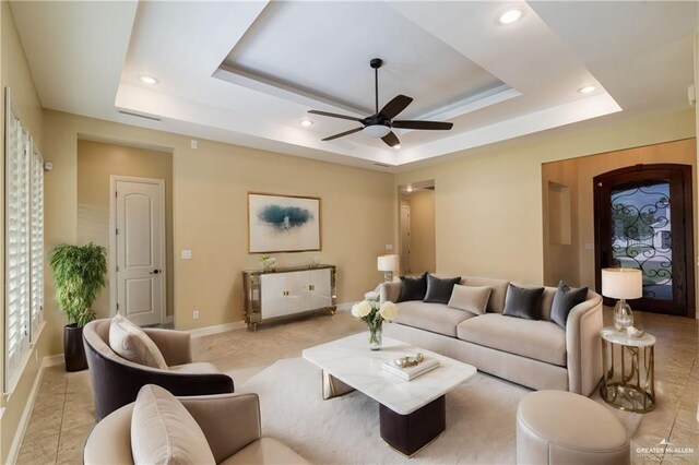 2014 Thacker Ln, Harlingen, TX 78552 - living area featuring a tray ceiling, a ceiling fan, and recessed lighting