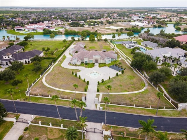 birds eye view of property with a residential view and a water view