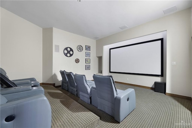 carpeted cinema room with baseboards