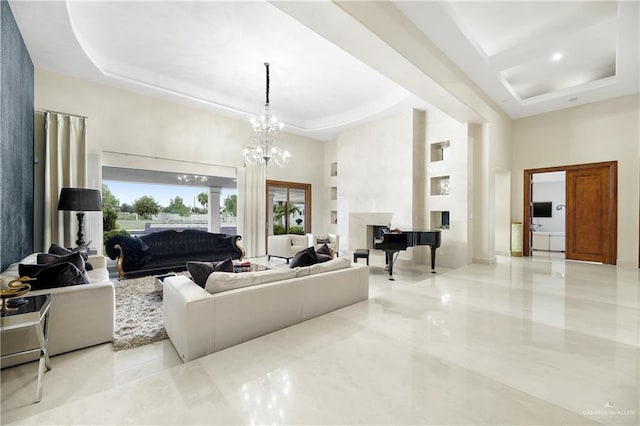 living area with a tray ceiling, an inviting chandelier, a towering ceiling, and a healthy amount of sunlight