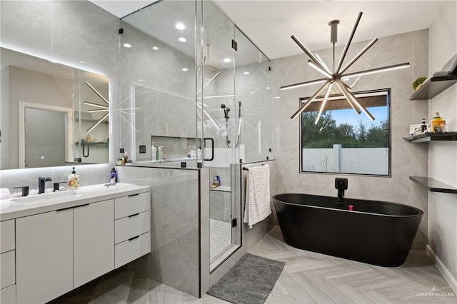 bathroom with vanity, parquet floors, independent shower and bath, and a chandelier