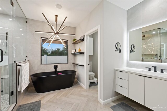 full bathroom with vanity, an inviting chandelier, parquet floors, and independent shower and bath