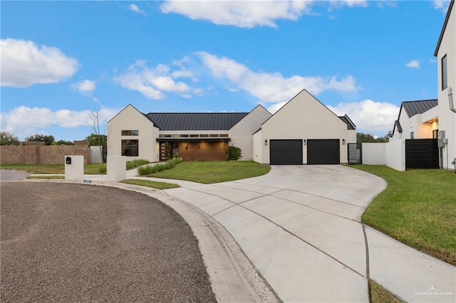 modern inspired farmhouse featuring a garage and a front lawn