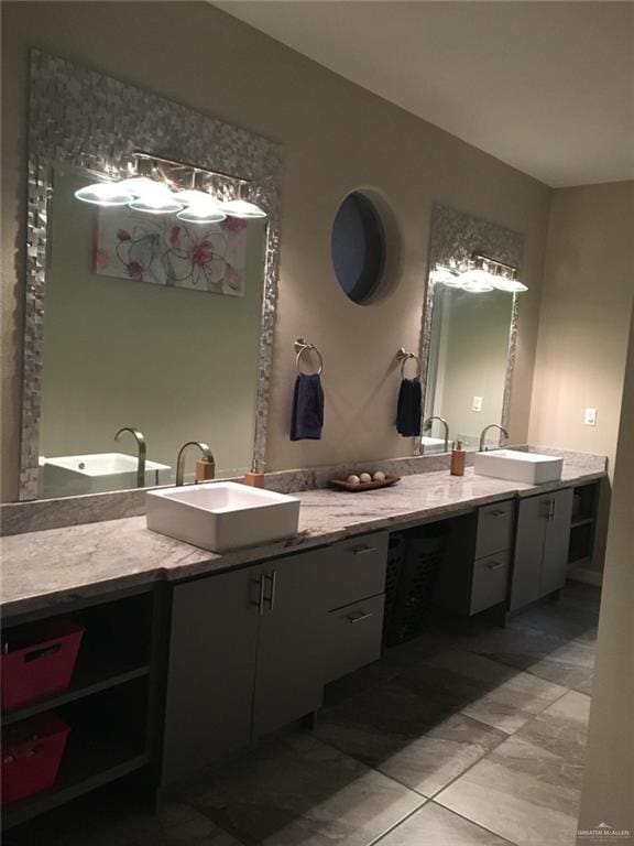 bathroom with double vanity and a sink