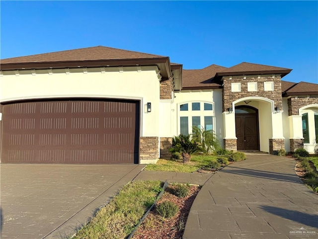 view of front of home with a garage, stone siding, concrete driveway, and stucco siding