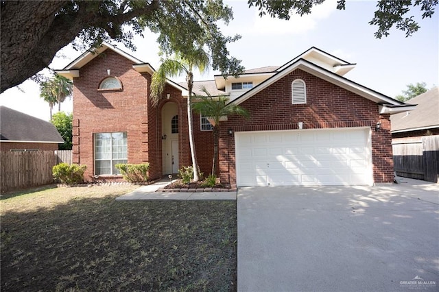 view of front property featuring a front yard and a garage