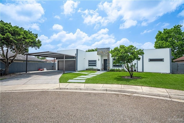 contemporary house with concrete driveway, stucco siding, and a carport