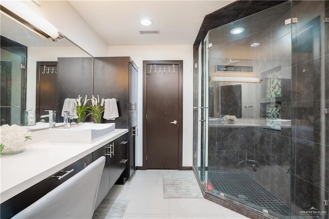 full bathroom with tile patterned flooring, a stall shower, vanity, and recessed lighting