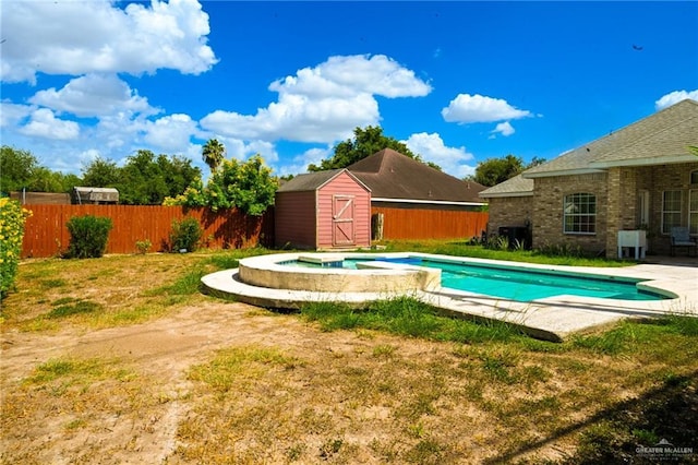 view of pool with an in ground hot tub, a shed, and a lawn