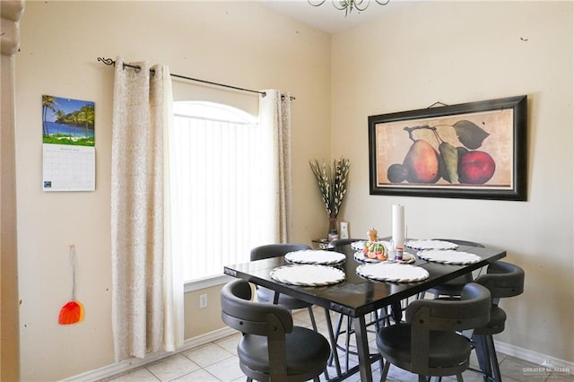 dining space featuring light tile patterned flooring